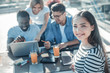 © Viacheslav Yakobchuk - Best friends forever. Selective focus on a young lady looking into the camera and smiling while sitting in a cafe and meeting with her mates.