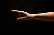 © Prostock-studio - Hand gestures - woman pointing, isolated at black