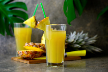 Wall Mural - Pineapple freshly squeezed juice in two glasses