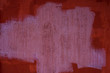 Old concrete wall painted in bright crimson color, background, texture of plaster