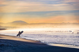 Entering the Surf on a Foggy Morning