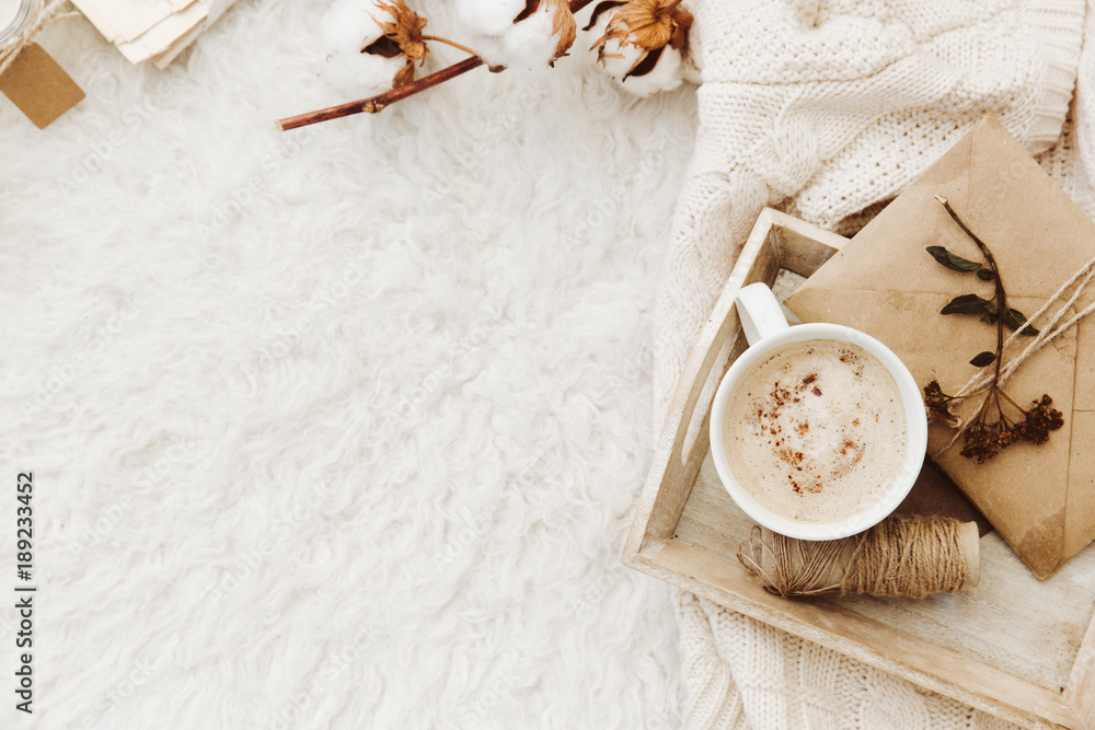 Winter cozy background with cup of coffee, warm sweater and old letters. Flat lay for bloggers - obrazy, fototapety, plakaty 