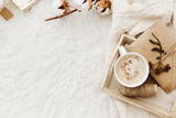 Fototapeta  - Winter cozy background with cup of coffee, warm sweater and old letters. Flat lay for bloggers