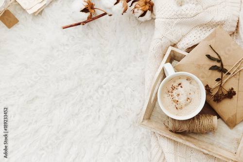 Winter cozy background with cup of coffee, warm sweater and old letters Tableau sur Toile
