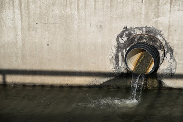 the water is drained through the pipe into the channel