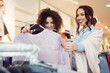 © zorandim75 - Two cheerful girls shopping for clothes