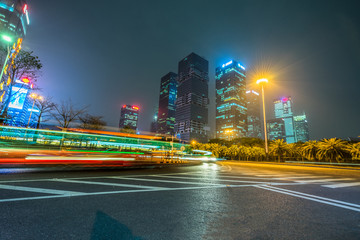 Wall Mural - the light trails on the modern building background.