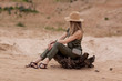 © Sviatlana - Girl in silk jumpsuit, details and lots of accessories, style of safari, side view