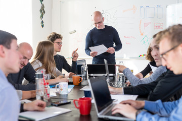 Wall Mural - relaxed informal it business startup company meeting. team leaders discussing and brainstorming new 