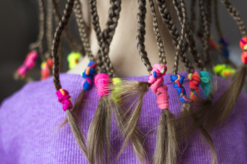 Poster - Close up of braid hair of little girl with colorful rubber bands