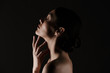 © Drobot Dean - Beautiful image in profile of half-naked gentle woman posing on camera with closed eyes isolated, over black background