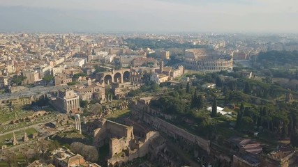 Wall Mural - Cityscape of Rome. Aerial view of Colosseum and ancinet Roman ruins