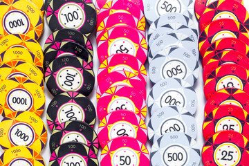 Wall Mural - casino colorful poker chips on a white background