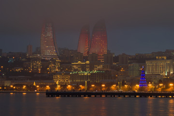 Wall Mural - Flame Towers in the foggy January twilight, Baku