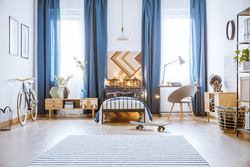 Skateboard in spacious bright bedroom