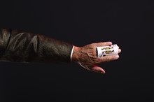 Magician Shows Trick With Playing Cards. Manipulation With Props. Sleight Of Hand.