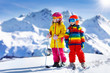 © famveldman - Ski and snow winter fun for kids. Children skiing.