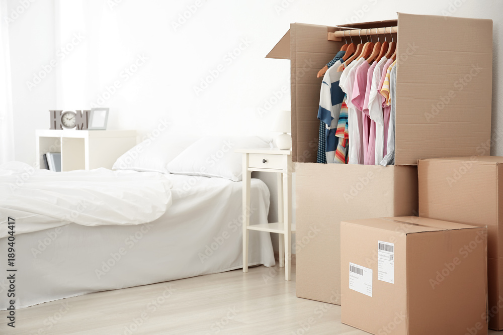 Wardrobe boxes with clothes indoors