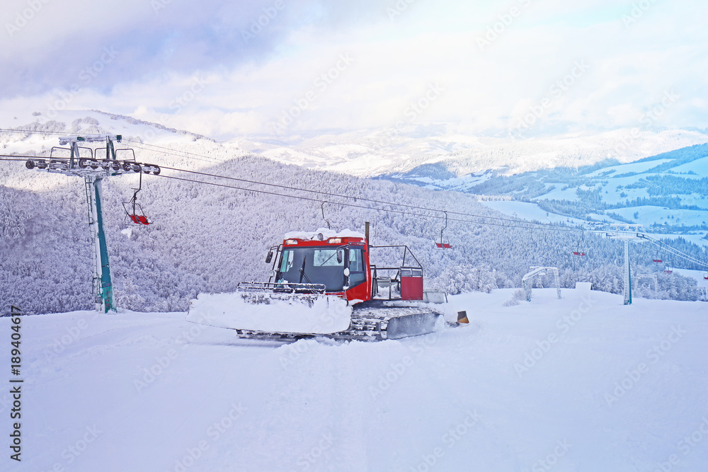 Snowplow machine at ski mountain resort
