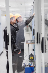 Wall Mural - field service crew testing electronics or inspecting electrical installation system