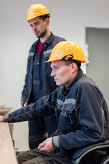 Wall Mural - two maintenance engineer work on relay protection system