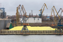 Huge Stockpile Of Industrial Sulfur That Will Be Shipped Around World. Industrial Sulfur Stockyard And Pile. Huge Stockpile Of Sulfur In Sea Port At Bulk Cargo Port Terminal