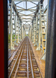 Fototapeta Most - Old steel railway bridge on the river