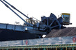 © alexhitrov - NAKHODKA, 2017: The place where the coal is being loaded into bulk cargo ship by big cargo cranes. Nakhodka bay, town of Nakhodka, the Far East of Russia. Aerial.