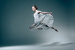 © LIGHTFIELD STUDIOS - attractive ballet dancer jumping in white dress