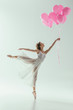 © LIGHTFIELD STUDIOS - ballerina in white dress dancing with pink balloons, isolated on white