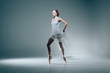 © LIGHTFIELD STUDIOS - elegant ballerina dancing in white dress