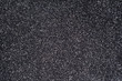 Soft rubber crumb black with white speckles texture.