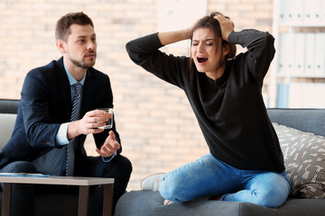 Wall Mural - Male psychologist with patient in office