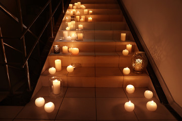 Wall Mural - Burning candles on stairs