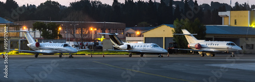Fotografía Scenic night view of private business jets standing on parking place at Corfu Ioannis Kapodistrias international airport