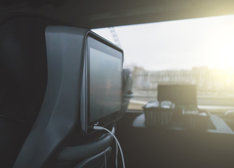 Interior inside of modern bus with monitor.