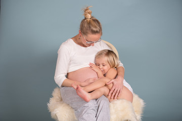 Pregnant mother with her daughter