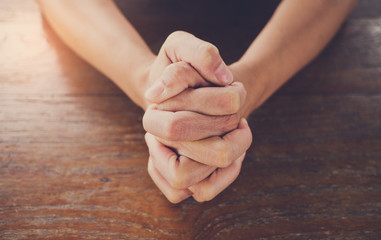 Wall Mural - woman praying in morning. Hands folded in prayer