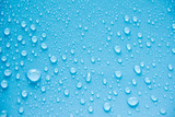 Fototapeta Las - Water Drops On Blue Background.