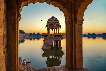 Fototapete - Gadisar lake (Gadi Sagar) at Jaisalmer Rajasthan with ancient temples and archaeological ruins at sunrise