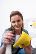© LIGHTFIELD STUDIOS - portrait of attractive woman with rag and disinfect spray cleaning home