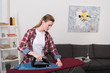 © LIGHTFIELD STUDIOS - portrait of attractive woman ironing clothing at home