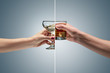 Hand holding a glass of whiskey