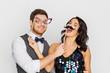 © Syda Productions - happy couple with party props having fun