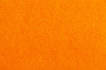 Wall Mural - A close up of orange felt material background.