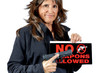 © Pamela Au - Attractive Woman holding a No Weapons Sign and a Handgun