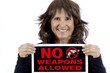 © Pamela Au - Mature Woman holding a No Weapons Sign