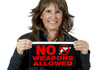 © Pamela Au - Middle Aged Woman holding a No Weapons Sign