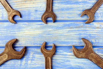 Hand tool. Old keys on a wooden table