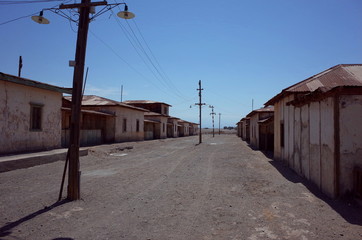 Wall Mural - An eerie street in the abandoned Humberstone saltpeter works. This abandoned nitrate town was extremely important for the early economy of Chile